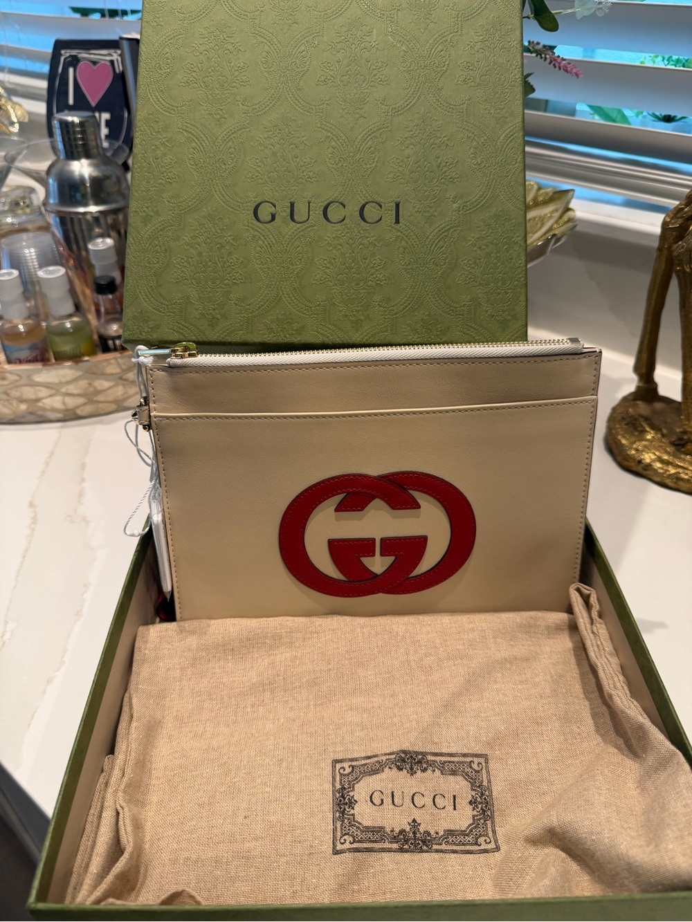 Authentic Gucci Cream Leather Zip Pouch with Red Double G Logo